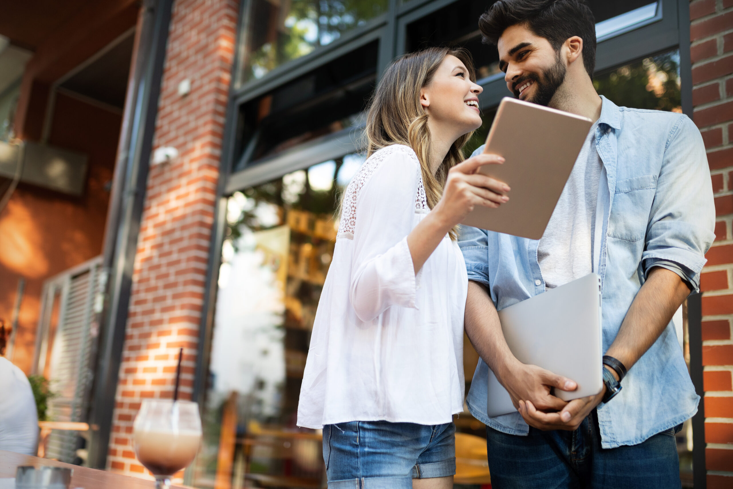 Beautiful couple in love dating outdoors and smiling